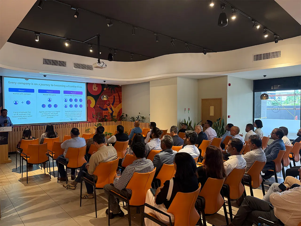 Audience attending a presentation in a conference.