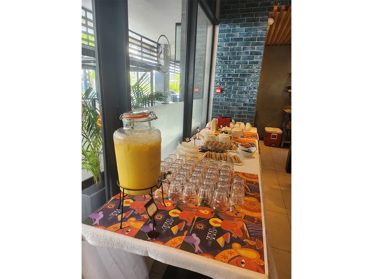 Buffet table with juice and snacks.