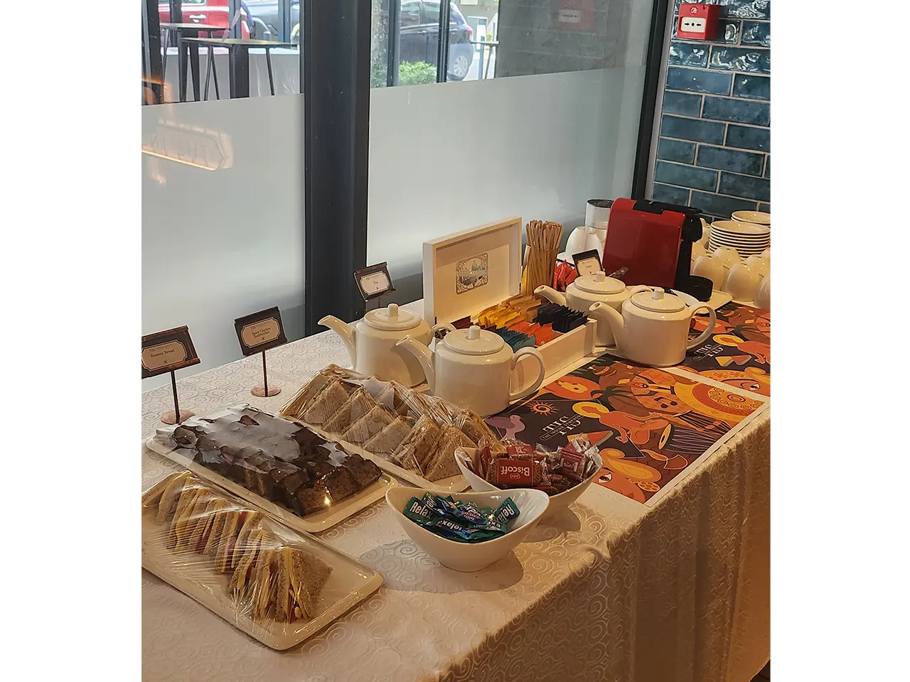 Tea and dessert table with pastries.
