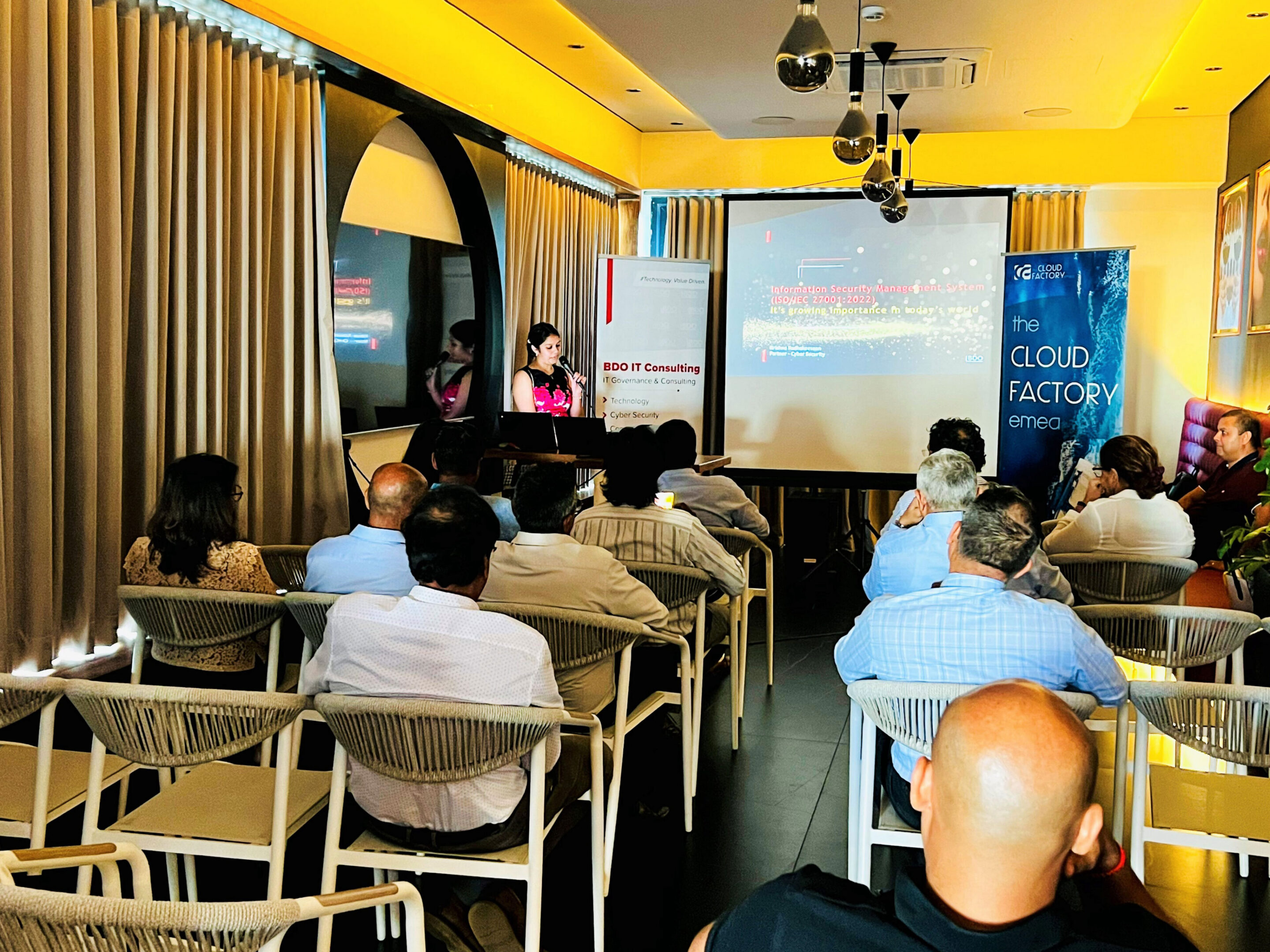 Audience attending a business presentation in conference.