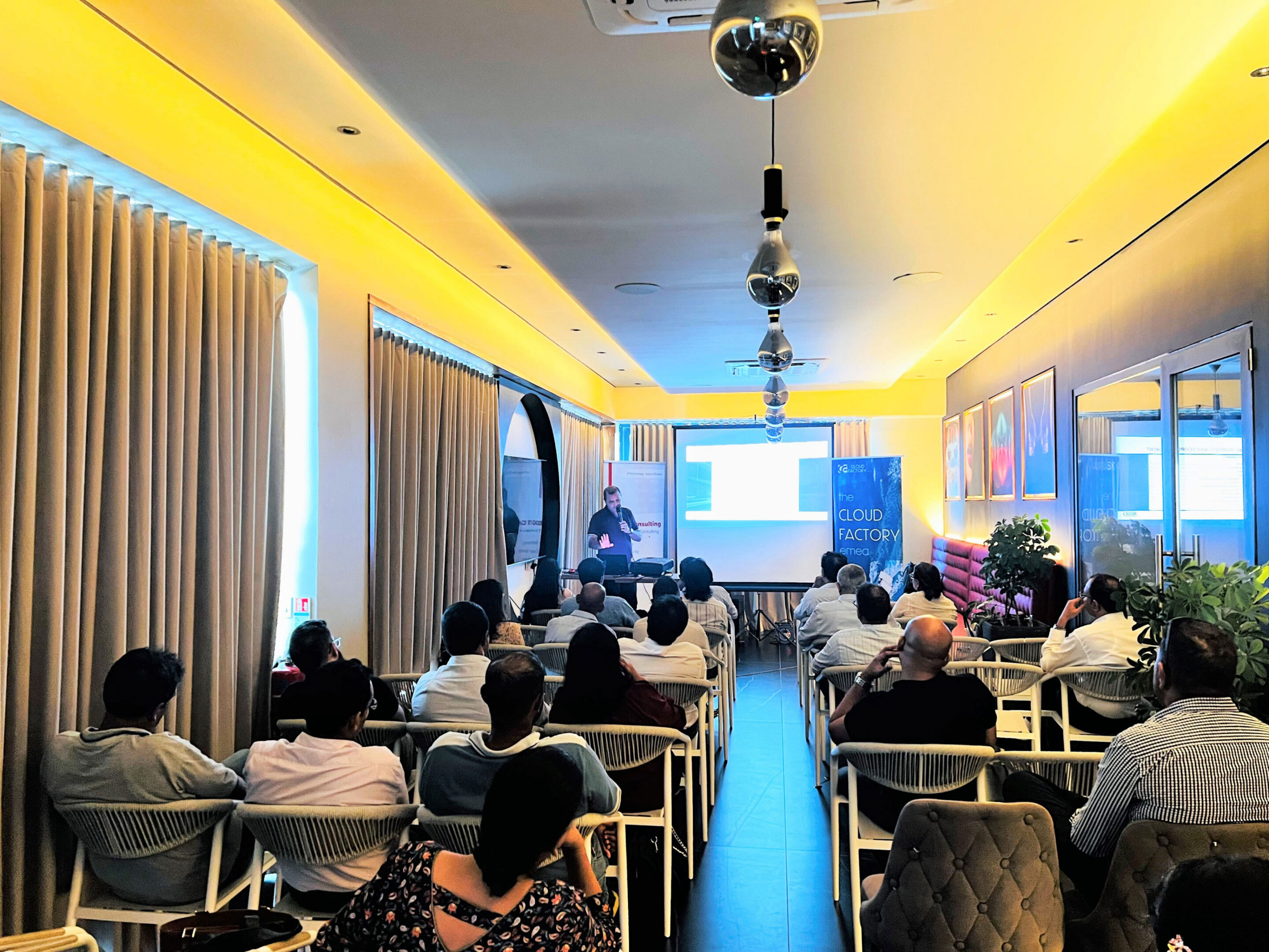 Audience attentively listening to a presentation.