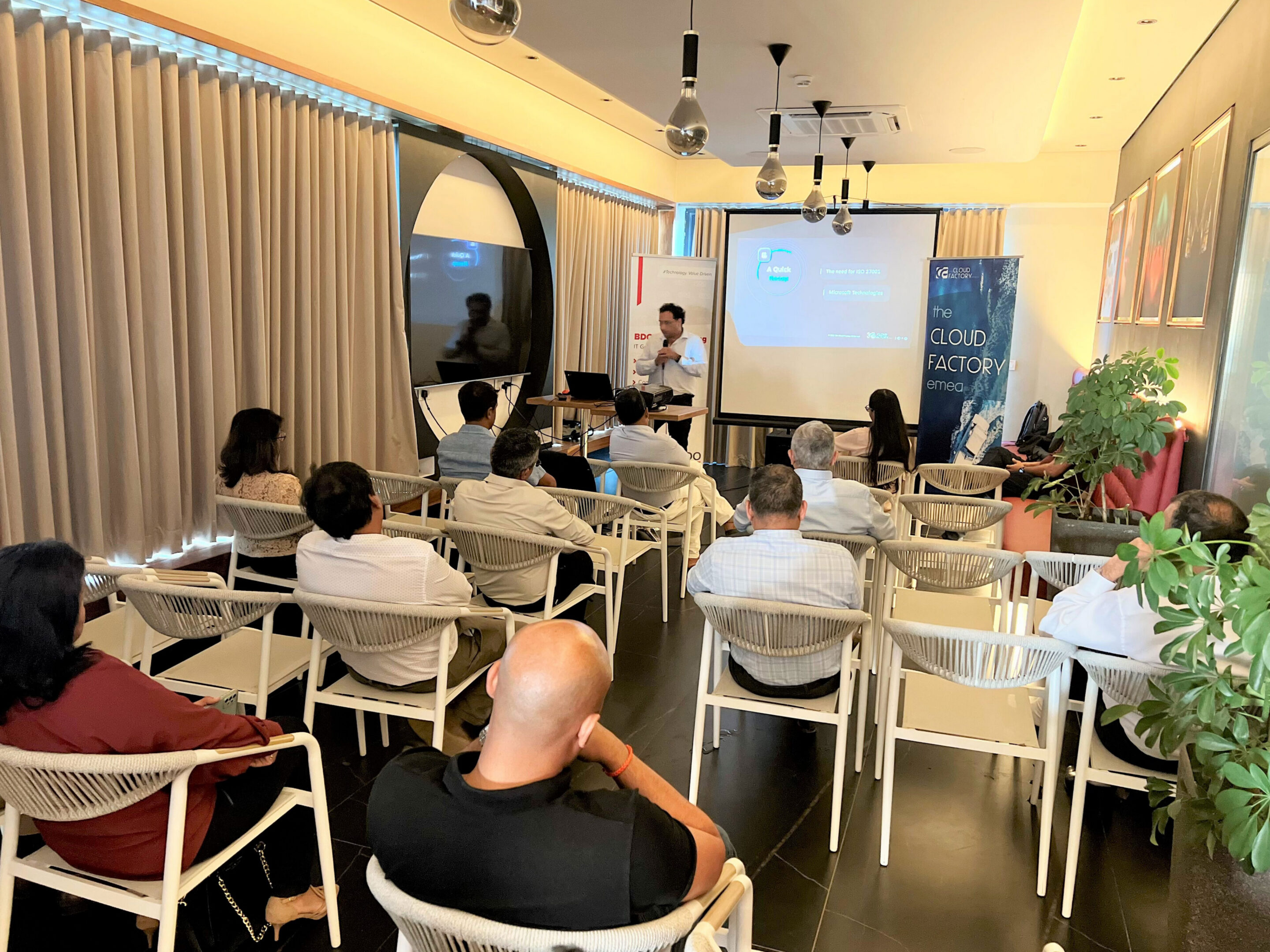 Presentation in a conference room with audience.