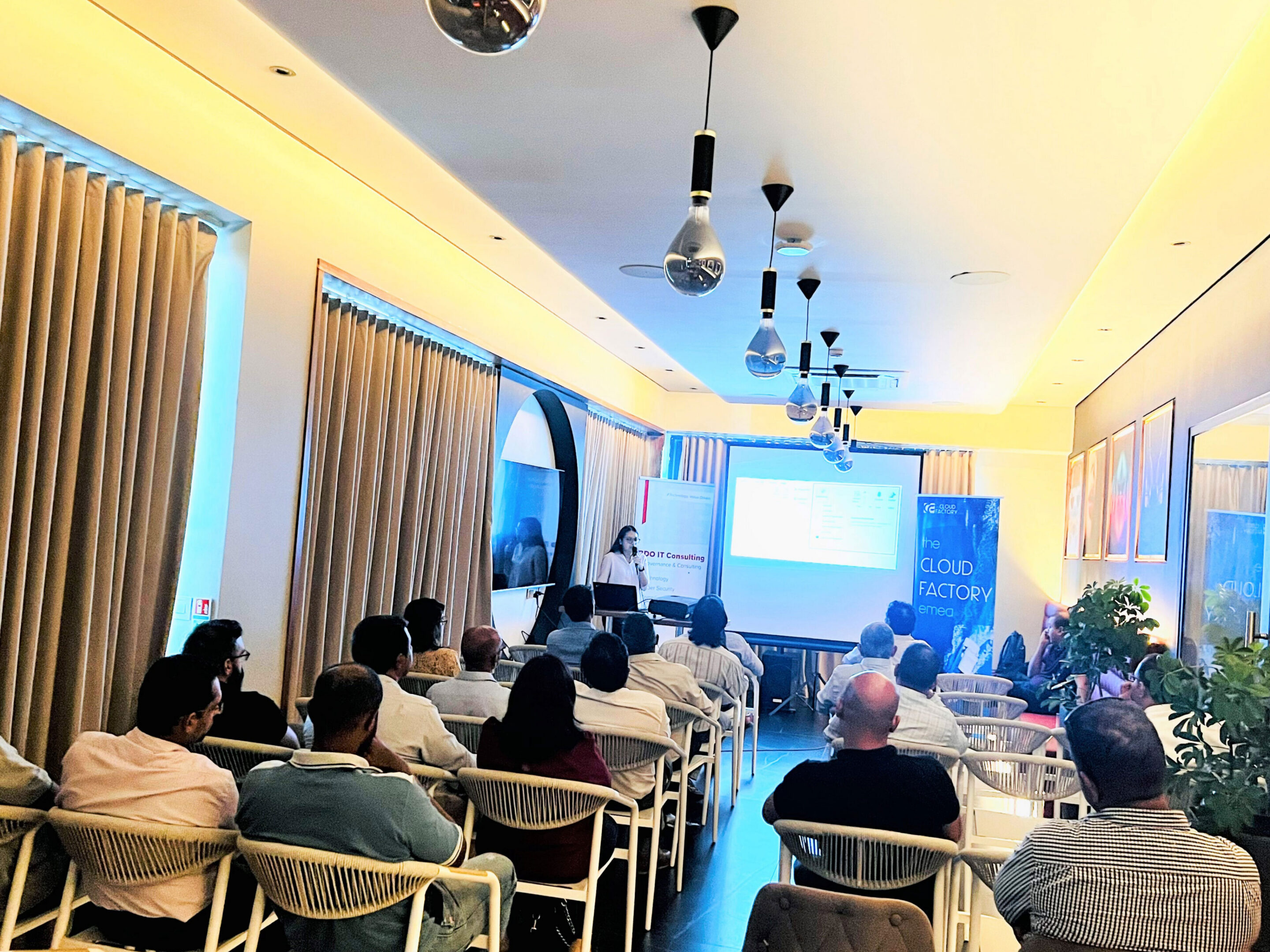 People attending a presentation in a room.