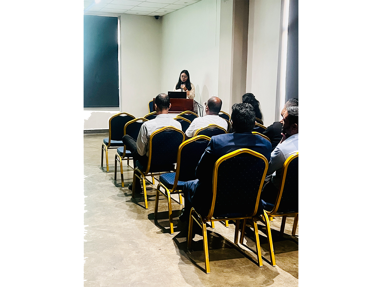 Presentation in a small conference room setting.