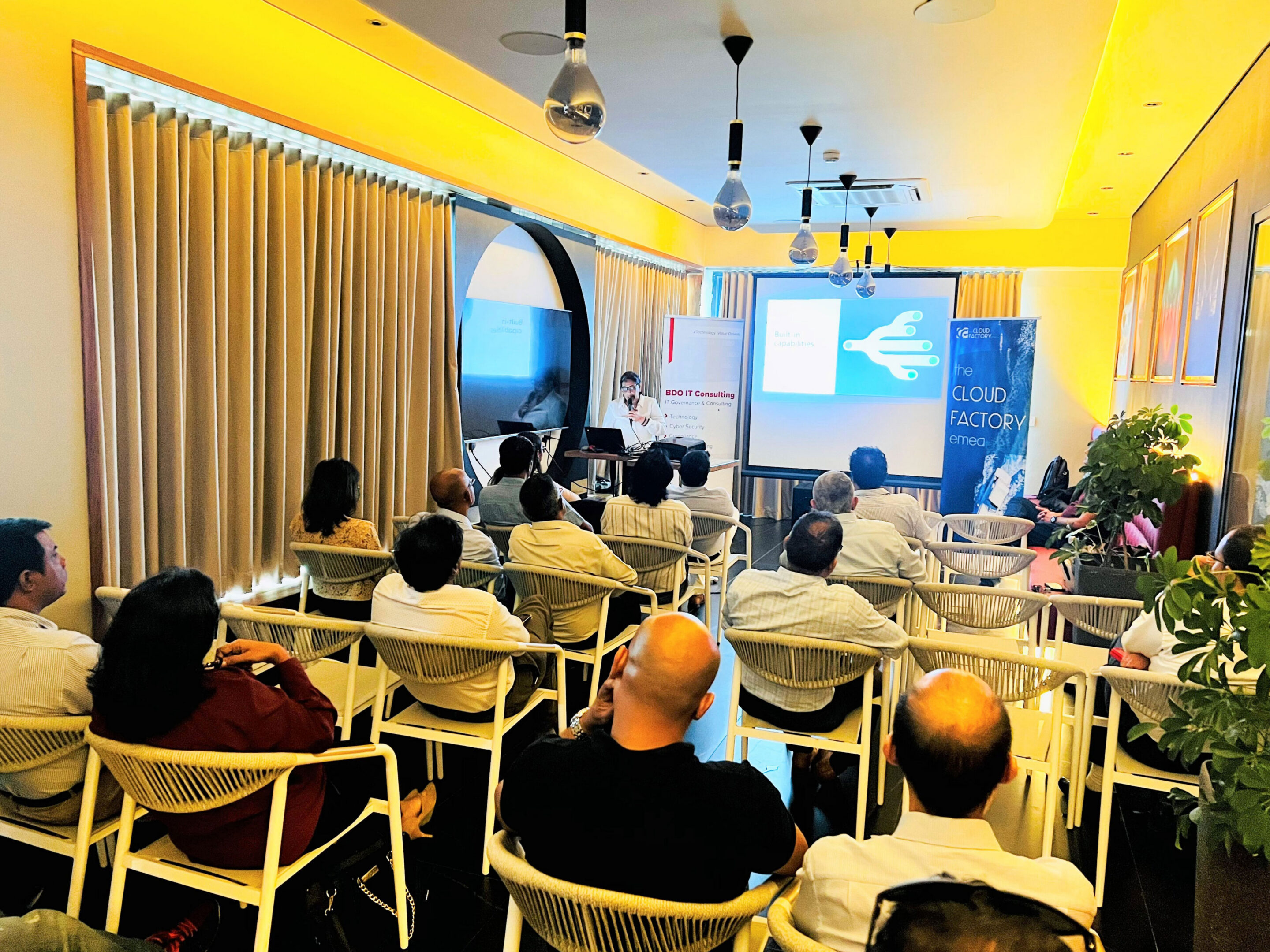 People attending a business presentation in conference room.