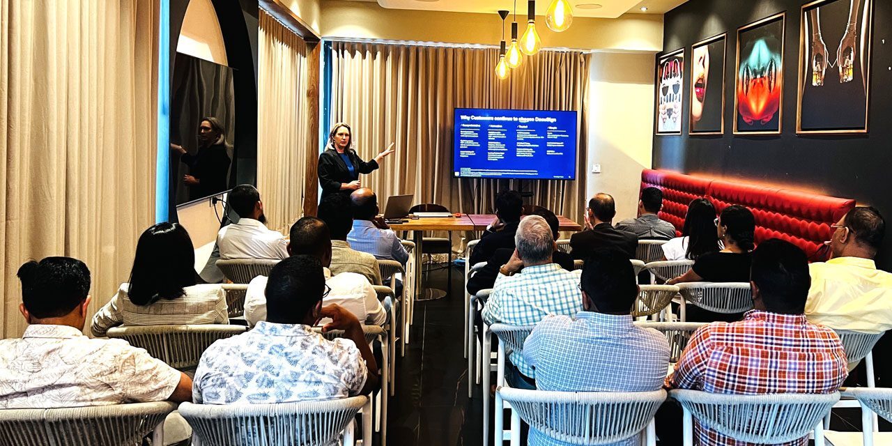 Audience attending a presentation in a room.